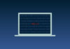 A computer with code and "hello" on its screen.